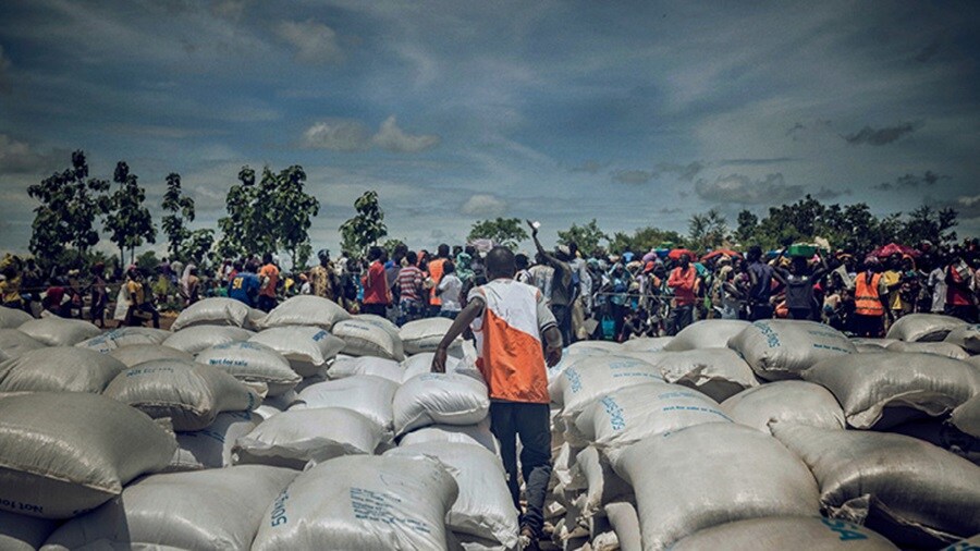 Remote location in Africa - People gathering at the emergency cargo storage point.