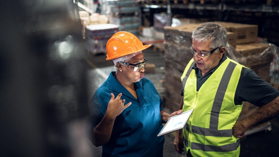 Coworkers on meeting at warehouse
