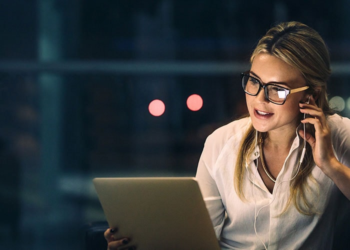 A booking services representative on a call with a customer.