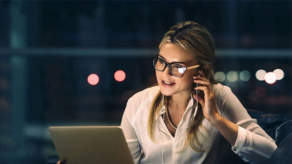 A booking services representative on a call with a customer.