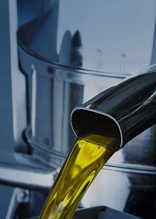 Liquid Cargo Solution | Close- up of liquid flow from metallic container.